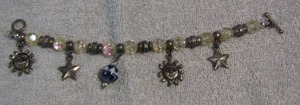 lot 106 image: CHARM BEADED BRACELETS