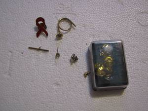 lot 270 image: PINS, EXTRA PIN BACKS, AND TIE TAC