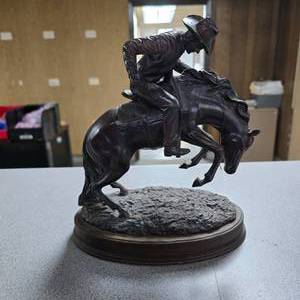 lot 257 image: Vintage Cowboy on Bucking Bronco Statue.  Artist unknown