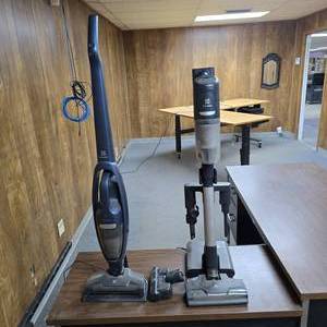 lot 277 image: Lot of 2 Electrolux Cordless Vacuum Cleaners w Charging Stations