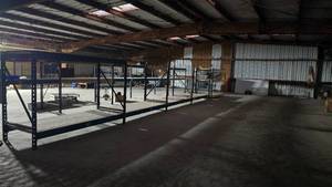 lot 287 image: 4 Sections of Industrial Racks w Extra Beams & Wire Shelving.  Buyer to dismantle.  Buyer must take all.