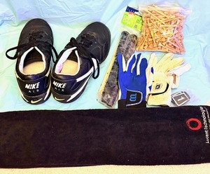 lot 57 image: Nike Air Golf Shoes, package of New Grips, Bag of Tees, Driving Gloves, &amp Towel