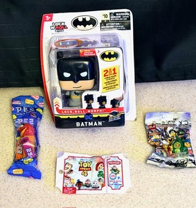 lot 116 image: NEW Collectible Toys Including Lock &amp Roll Batman, and Toys from Toy Story 4, LEGO, &amp PEZ