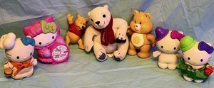 lot 122 image: Vintage Care Bears 3 Poseable Funshine Bear Toy Figure, Along With Coca-Cola Bear, Winnie the Pooh Figure, &amp Four (4) Hello Kitty Figures