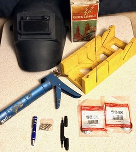 lot 149 image: Assorted Tools &amp Supplies - Including Welding Helmet, Cordless Quick Charge Industrial Soldering Gun, Mitre Box, &amp Milwaukee Angle Grinder New Parts