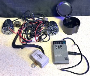 lot 151 image: Pyle Cycle Series Amplifier &amp Speakers for Harley Davidson, General Electric VOICE-1 Helmet Adaptable 2-Way Communication, &amp Ford Motor Company Ashtray for Cup Holder