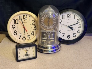 lot 183 image: Two Wall Clocks, an Anniversary Clock, &amp a Bell Howell Alarm Clock