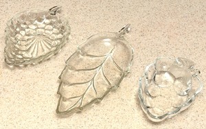 lot 258 image: 1950s Anchor Hocking Clear Glass Grape Cluster-Shaped Candy or Nut Dish, Vintage Clear Glass Leaf-Shaped Serving Dish, &amp Vintage Studio Nova Mikasa Natures Harvest Grape Pattern Candy or Nut Dish