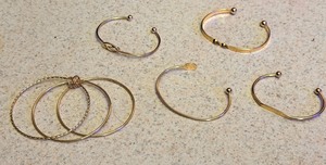 lot 265 image: Five (5) Piece Gold-Toned Bracelet Set