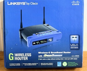lot 99 image: LINKSYS by Cisco Wireless-G Broadband RouterWSpeedBooster