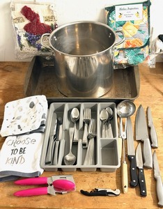 lot 283 image: Huge Kitchen Lot - Including stock Pot, 17x13 Cake Pan, Oster Knives, Kitchen Towels, Tomodachi 1810 Flatwear, New Apron, Mitt,&amp Pot Holder Set, and Much More