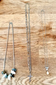 lot 303 image: Artisanal Handsrafted Necklace Featuring an Unmarked Necklace Adorned With Smooth Gemstones, Stainless Steel Cross Pendant Necklace Featuring Two-Style Chain, & Drop Pendant Necklace WThree-Stone Cluster and a Single Pearl Drop
