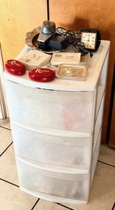 lot 306 image: Sterilite Three Drawer Storage Container WContents - Including Vintage Norelco Electric Razor, Travel Alarm Clock, Soap from Hotels & Casinos Around the World, & a Whole Lot More