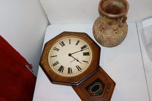 lot 53 image: Seth Thomas wall clock and decorative pottery vase