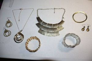 lot 77 image: Gold toned jewelry and silver tone stretch bracelet