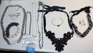 lot 87 image: Safety pin and black beaded jewelry