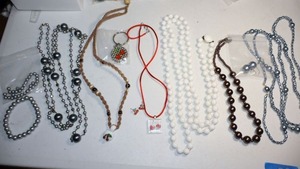 lot 89 image: Colored faux pearl jewelry and cherry themed jewelry