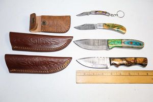 lot 141 image: Damascus steel knives Hunting knives, folding pocket knife, and key chain knife
