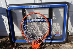 Plastic LIFETIME basketball backboard and metal hoop