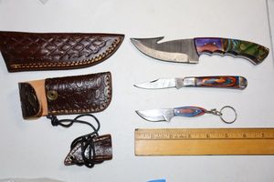 lot 25 image: Damascus steel knives - Hunting knife, folding pocketknife, and keychain knife