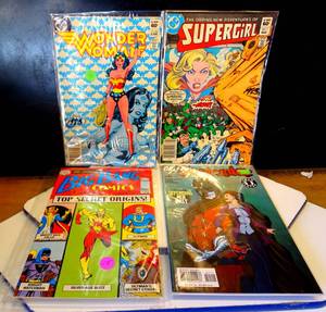 lot 70 image: LOT OF 4 COMIC BOOKS AS SHOWN