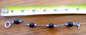 lot 240 image: $$$ P.B .925 STERLING BLACK STONE AND STERLING BRACELET