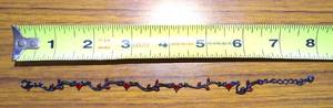 lot 247 image: UNIQUE BLACK TONED AND GARNET STYLE GEMSTONE BRACELET