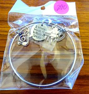 lot 290 image: LOVELY MUSIC THEMED CHARMED BRACELET - NIP