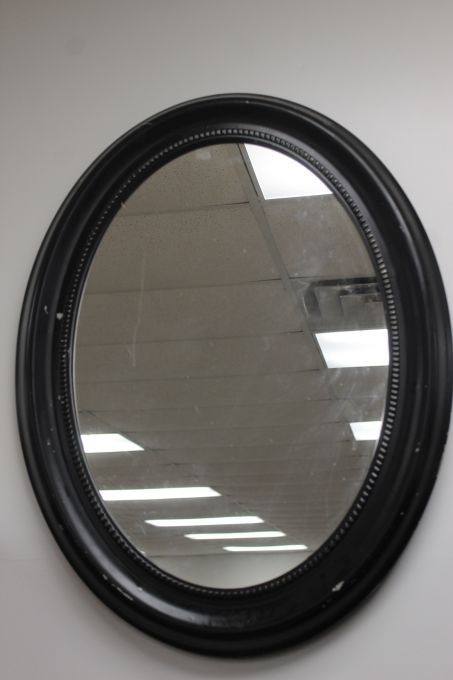 lot 59 image: Framed black oval wall mirror