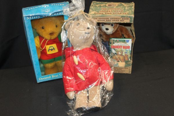 lot 103 image: Three collectible Bears Vintage Paddington circa 1970s, The official Smokey Bear Book and Bear Set in Original box, and Vintage plush teddy bear from the Russ Misty Mountain Dressed Bear Collection