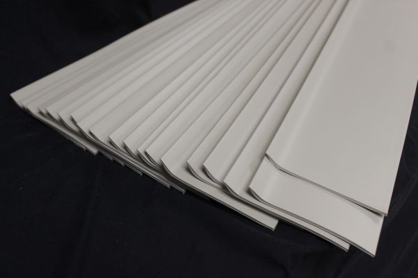 lot 212 image: Vinyl Baseboard Trim, 18 strips