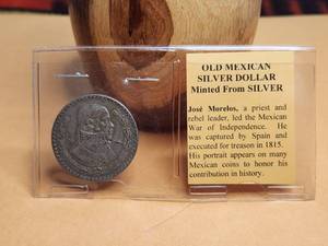 lot 22 image: 1958 Mexican silver dollar