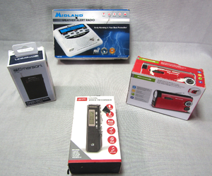 lot 5 image: Midland weather alert radio, Emerson AMFM portable radio, GPX digital voice recorder, WeatherX AMFM weather band hand crank radio with flashlight. All NIB