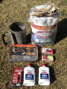 lot 26 image: Kingsford charcoal, lighter fluid, Coleman fuel gauge, coal scuttle and Instant charcoal grill