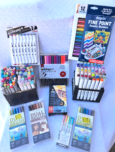 lot 292 image: Crayola fine point doodle markers, Kingart & Tombow twin tip brush pens, Aretskills permanent markers, and more as shown