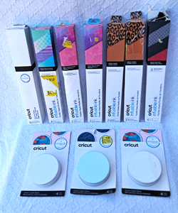 lot 275 image: Cricut infusable ink transfer sheets, 7 rolls, and Cricut ceramic coaster blanks 3 packs 4 per pack
