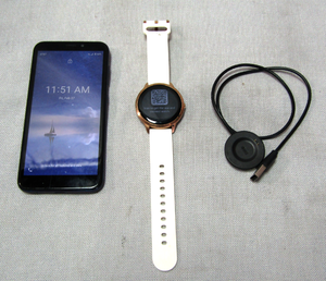 lot 31 image: iTech Elite 3 smart watch plus charger, AT&T Android cell phone (Locked)
