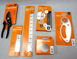 lot 46 image: Fiskars rotary blades, Sewing rulers, Pruners, Compass & protractor set, Loop rotary cutter - All NIB