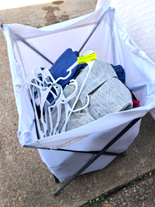 lot 215 image: Clothing hamper full of clothes and hangers