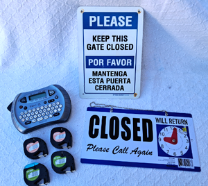 lot 89 image: Brother P-Touch label maker plus extra cartridges, Closed and Please keep the gate closed signs