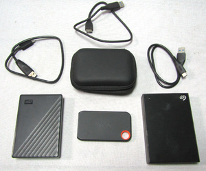 lot 230 image: Onn SSD, Seagate and Western digital portable hard drives plus data cords