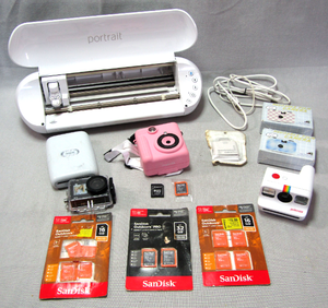 lot 302 image: Sandisk SDHC cards, Polaroid instant camera, Vivitar InstaPrint Digital Camera, Silhouette Portrait 3 photo printer, and more as shown