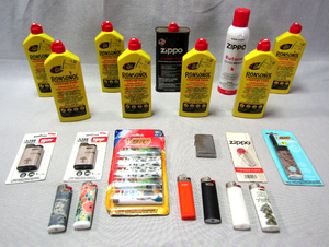 lot 102 image: Zippo lighter and Butane and lighter fuel, Ronsonol lighter fuel (7 bottles), Djeep lighters, Bic lighter pack plus