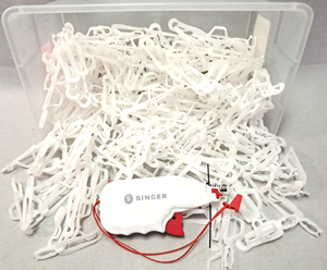 lot 129 image: Singer clothing tagger and tag clips as shown