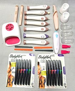 lot 130 image: Body Mark Tatoo markers NIB, pedicure rotary files, nail dryer and more as shown