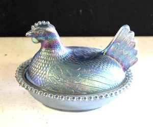 lot 23 image: vintage Indiana Glass Company Hen on a Nest covered candy dish in blue carnival glass.