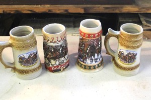 lot 38 image: Budweiser 1986 Holiday Series B Stein and 1994 Budweiser Hometown Holiday Stein and 2-collectible beer steins