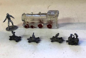 lot 42 image: small, vintage miniature pewter train cars, and vintage pewter miniature figure, specifically a 1995 Star Trek The Next Generation Worf figurine. And vintage clear glass train