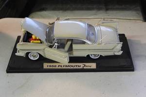 lot 57 image: die-cast model of a 1958 Plymouth Fury