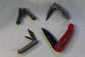 lot 62 image: collection of multi-tools and folding pocket knives
